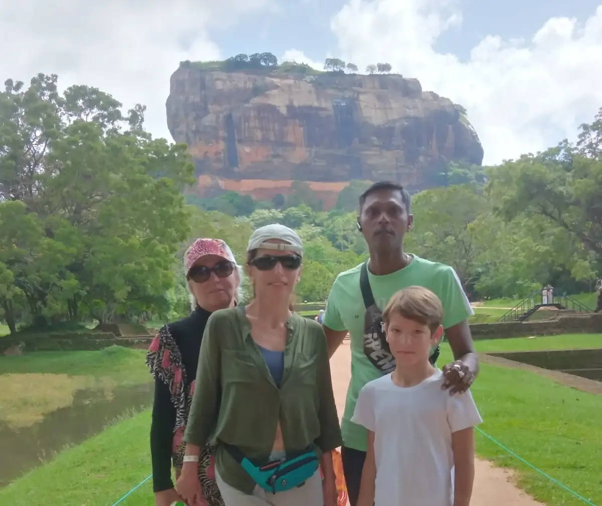 Dinesh with tours in front of Sigiriya rock fortress